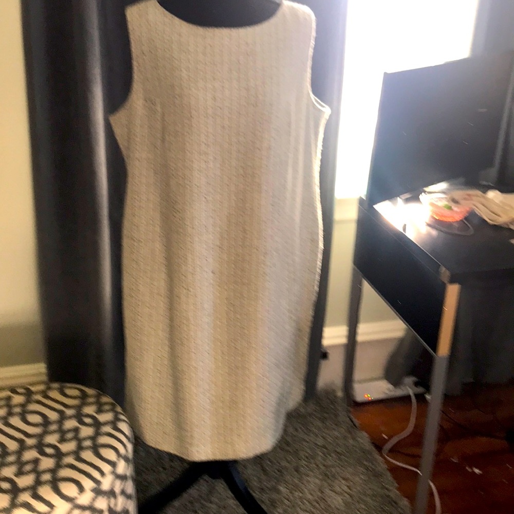 Fully lined sleeveless dress.